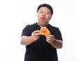 Young Funny Fat Asian man eating hawaiian pizza isolated on white background Royalty Free Stock Photo