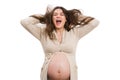 Young funny future mom throwing hair in the air while screaming Royalty Free Stock Photo