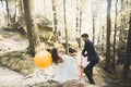 Young funny happy wedding couple outdoors with ballons Royalty Free Stock Photo