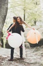 Young funny happy wedding couple outdoors with ballons Royalty Free Stock Photo