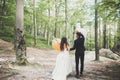 Young funny happy wedding couple outdoors with ballons Royalty Free Stock Photo