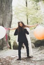 Young funny happy wedding couple outdoors with ballons Royalty Free Stock Photo