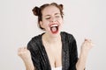 Young funny hipster woman showing tongue, shouting and surprise with funny emotion face.