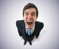 Young funny mad businessman or boss is shouting. View from top Royalty Free Stock Photo