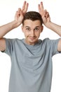 young funny man grimacing on white background Royalty Free Stock Photo