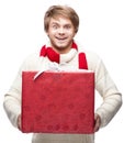 Young funny man holding christmas gift Royalty Free Stock Photo