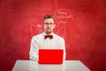 Young funny man with laptop at St. Valentine`s Day Royalty Free Stock Photo