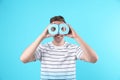 Young funny man looking through toilet paper Royalty Free Stock Photo