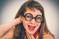 Funny nerd or geek woman with sexual expression on face