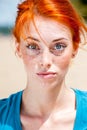 Young funny redhead woman looking surprise