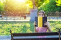 Young funny woman covers her face with a book because of feeling surprise and shock.Emotional girl holding a book in her hands Royalty Free Stock Photo