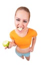 Young funny woman with green apple Royalty Free Stock Photo