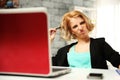 Young funny woman sitting at her workplace Royalty Free Stock Photo