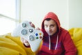 A young gamer shows a white gamer gaming joystick close up. Concept Video Games.