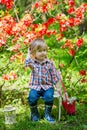 Young gardener in the spring blossoms