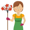 Young gardening woman standing with rake and autumn maple leaves Royalty Free Stock Photo