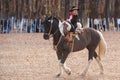 A young Gaucho riding a horse in exhibition Royalty Free Stock Photo