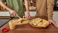 Young gay couple cutting banana standing side by side Royalty Free Stock Photo