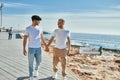 Young gay couple smiling happy walking at the beach promenade Royalty Free Stock Photo