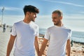 Young gay couple smiling happy walking at the beach promenade Royalty Free Stock Photo