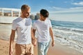 Young gay couple smiling happy walking at the beach Royalty Free Stock Photo