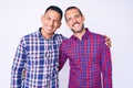 Young gay couple of two men wearing casual clothes winking looking at the camera with sexy expression, cheerful and happy face Royalty Free Stock Photo