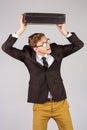 Young geeky businessman holding briefcase Royalty Free Stock Photo