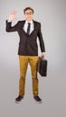 Young geeky businessman holding briefcase Royalty Free Stock Photo