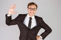 Young geeky businessman smiling at camera