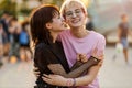 Young gender fluid couple hugging