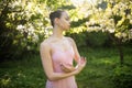 Gentle ballerina in pink dress dancing in the park Royalty Free Stock Photo