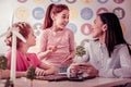 Young ginger girl carrying mobile phone and expressively talking Royalty Free Stock Photo