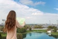 Young girk tourist with map sightseeing View on Olympiapark with Royalty Free Stock Photo