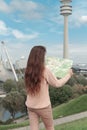 Young girk tourist with map sightseeing View on Olympiapark with