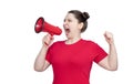 Young girl activist in a red t-shirt screaming into a megaphone, isolated on white background