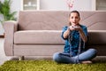 The young girl addicted to tv wasting her time Royalty Free Stock Photo