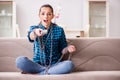 The young girl addicted to tv wasting her time Royalty Free Stock Photo