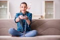 The young girl addicted to tv wasting her time Royalty Free Stock Photo