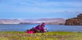 Young girl admiring ocean and mountains - Isle of Skye, Scotland