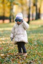 Young girl with adult glasses in the park autumn, funny