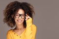 Young girl with an afro wearing eyeglasses Royalty Free Stock Photo