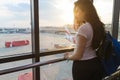 Young Girl In Airport Lounge Looking In Window Plane Waiting Departure Happy Smile Woman Royalty Free Stock Photo