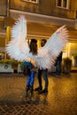 Young girl with angel wings on Lviv streets