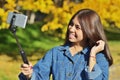 A young girl of Asian appearance uled makes a selfie