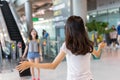 Young girl asian traveler hugging friend