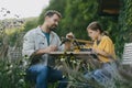 Father supporting daughter in pursuing robotics, science, IT technologies and programming. Young girl assembling a