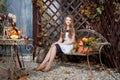 Young girl in autumn fairy garden. Fall