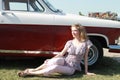 a young girl on the background of a retro car Royalty Free Stock Photo