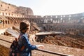 Young Girl With Backpack Exploring Inside The Coliseum