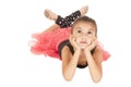 Young girl ballerina laying down looking up